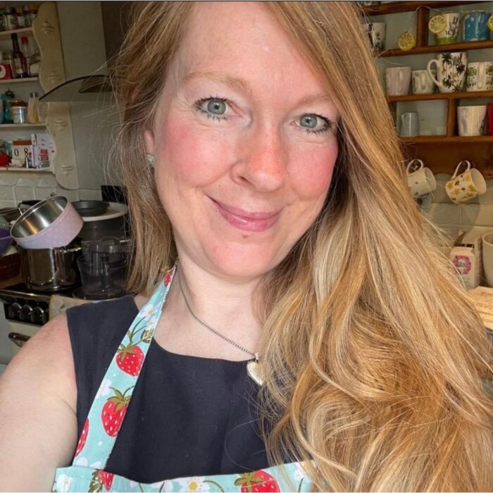 Head shot of Lisa Finch wearing an apron in the kitchen